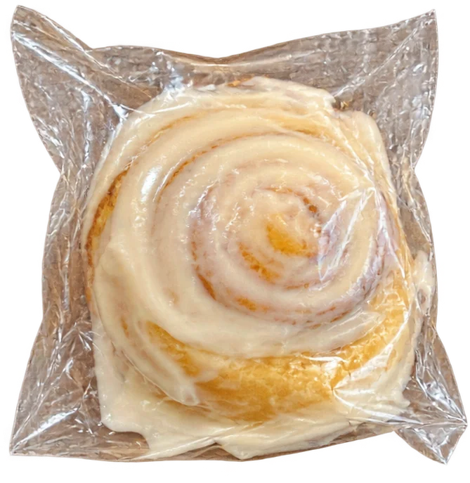 Classic glazed Sweet Crumb cinnamon roll individually wrapped in clear plastic
